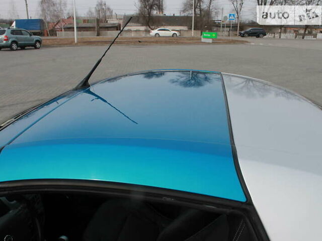 Синий Опель Тигра, объемом двигателя 1.4 л и пробегом 98 тыс. км за 5800 $, фото 40 на Automoto.ua