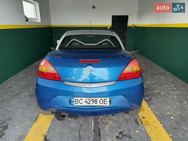 Синий Опель Тигра, объемом двигателя 1.39 л и пробегом 200 тыс. км за 4300 $, фото 3 на Automoto.ua