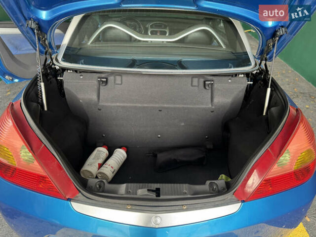 Синий Опель Тигра, объемом двигателя 1.39 л и пробегом 200 тыс. км за 4300 $, фото 9 на Automoto.ua