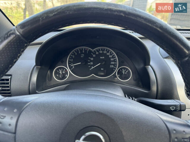 Синий Опель Тигра, объемом двигателя 1.39 л и пробегом 200 тыс. км за 4300 $, фото 28 на Automoto.ua