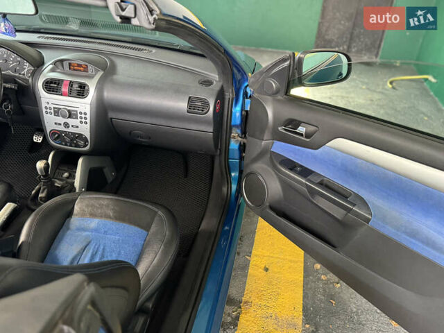 Синий Опель Тигра, объемом двигателя 1.39 л и пробегом 200 тыс. км за 4300 $, фото 18 на Automoto.ua