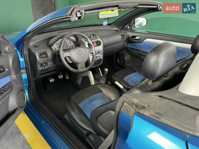 Синий Опель Тигра, объемом двигателя 1.39 л и пробегом 200 тыс. км за 4300 $, фото 20 на Automoto.ua