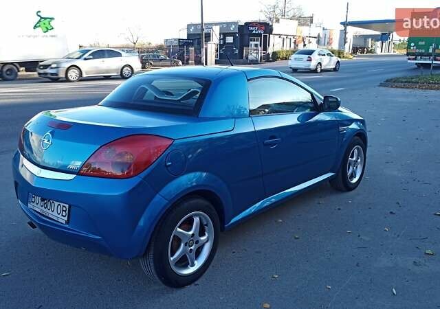 Синий Опель Тигра, объемом двигателя 1.3 л и пробегом 215 тыс. км за 5700 $, фото 5 на Automoto.ua