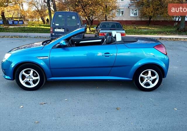 Синий Опель Тигра, объемом двигателя 1.3 л и пробегом 215 тыс. км за 5700 $, фото 8 на Automoto.ua