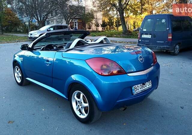 Синий Опель Тигра, объемом двигателя 1.3 л и пробегом 215 тыс. км за 5700 $, фото 15 на Automoto.ua