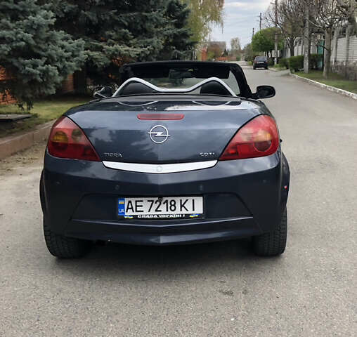 Синий Опель Тигра, объемом двигателя 1.3 л и пробегом 236 тыс. км за 4100 $, фото 3 на Automoto.ua