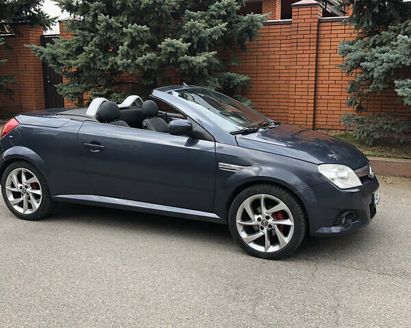 Синий Опель Тигра, объемом двигателя 1.3 л и пробегом 236 тыс. км за 4100 $, фото 1 на Automoto.ua