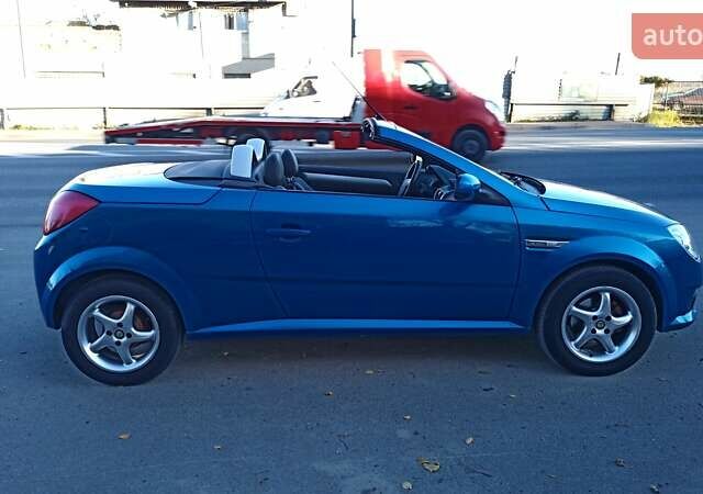 Синий Опель Тигра, объемом двигателя 1.3 л и пробегом 215 тыс. км за 5700 $, фото 12 на Automoto.ua