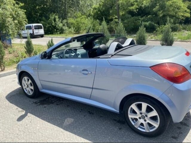 Синий Опель Тигра, объемом двигателя 1.4 л и пробегом 215 тыс. км за 4000 $, фото 6 на Automoto.ua