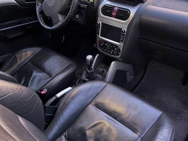 Синий Опель Тигра, объемом двигателя 1.4 л и пробегом 215 тыс. км за 4000 $, фото 4 на Automoto.ua