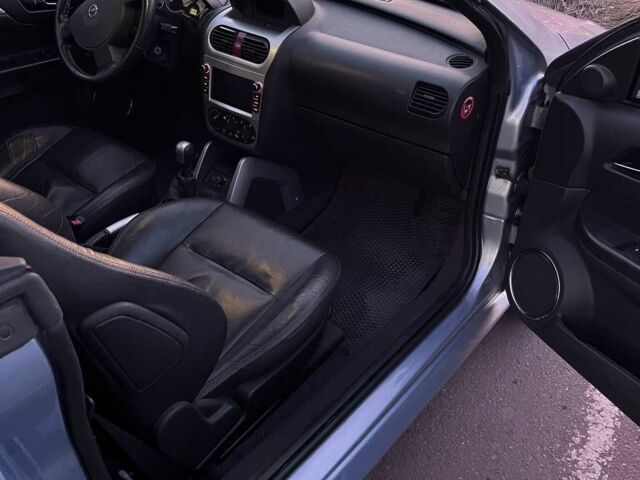 Синий Опель Тигра, объемом двигателя 1.4 л и пробегом 215 тыс. км за 4000 $, фото 5 на Automoto.ua