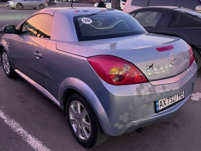 Синий Опель Тигра, объемом двигателя 1.4 л и пробегом 215 тыс. км за 4000 $, фото 2 на Automoto.ua