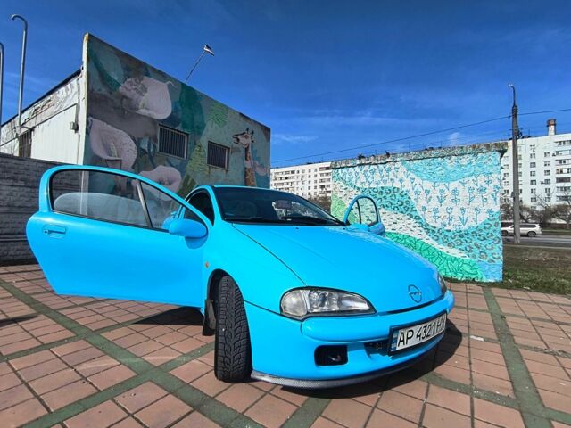 Синий Опель Тигра, объемом двигателя 1.4 л и пробегом 269 тыс. км за 2999 $, фото 9 на Automoto.ua