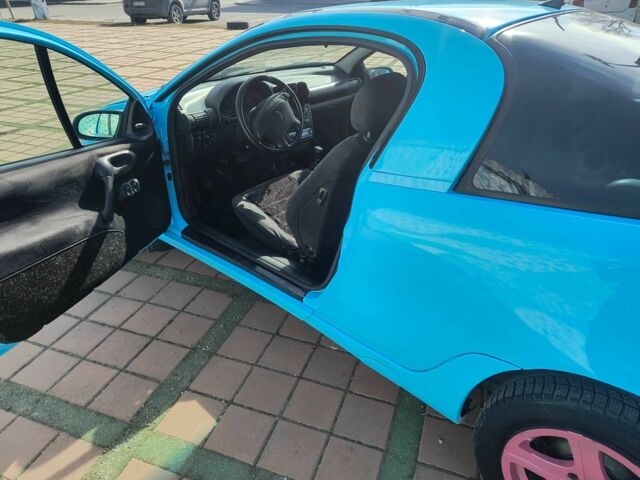 Синий Опель Тигра, объемом двигателя 1.4 л и пробегом 269 тыс. км за 2999 $, фото 6 на Automoto.ua