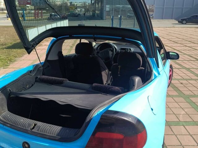 Синий Опель Тигра, объемом двигателя 1.4 л и пробегом 269 тыс. км за 2999 $, фото 4 на Automoto.ua