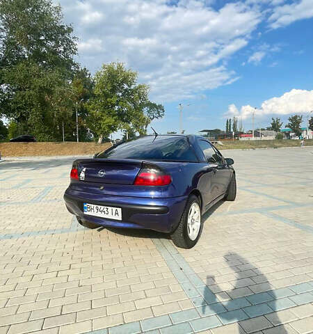 Синий Опель Тигра, объемом двигателя 1.4 л и пробегом 242 тыс. км за 3300 $, фото 1 на Automoto.ua