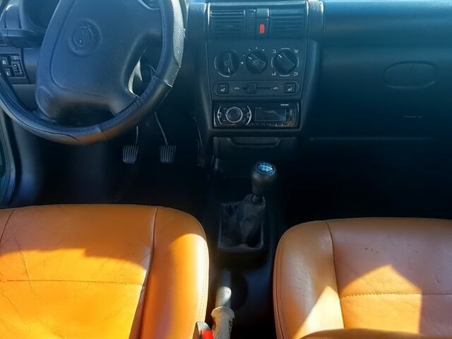 Зеленый Опель Тигра, объемом двигателя 1.4 л и пробегом 220 тыс. км за 2700 $, фото 11 на Automoto.ua