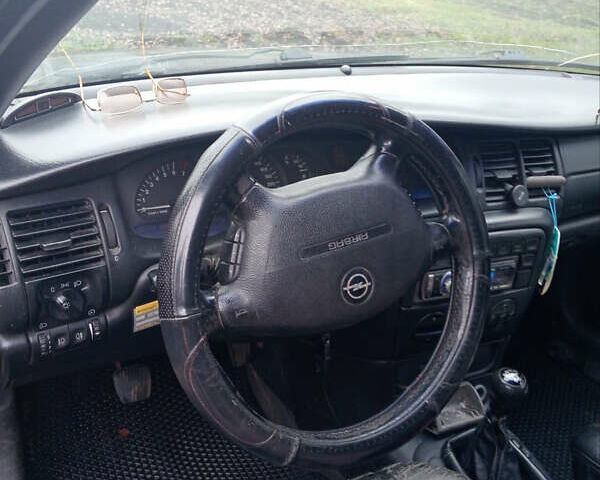 Черный Опель Вектра, объемом двигателя 1.8 л и пробегом 454 тыс. км за 1750 $, фото 4 на Automoto.ua