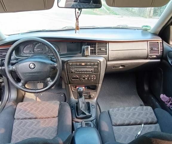 Чорний Опель Вектра, об'ємом двигуна 2 л та пробігом 337 тис. км за 2400 $, фото 4 на Automoto.ua