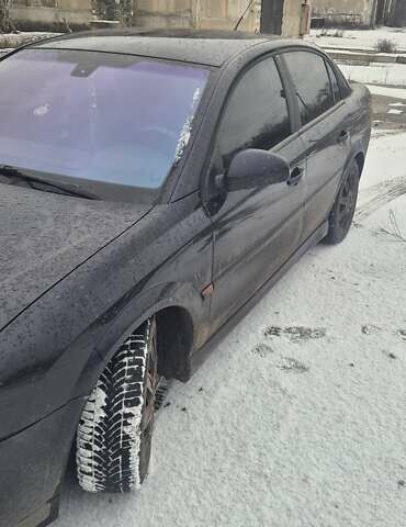 Чорний Опель Вектра, об'ємом двигуна 2 л та пробігом 369 тис. км за 1999 $, фото 2 на Automoto.ua