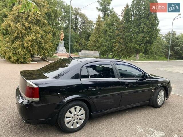 Черный Опель Вектра, объемом двигателя 2.2 л и пробегом 240 тыс. км за 6000 $, фото 4 на Automoto.ua