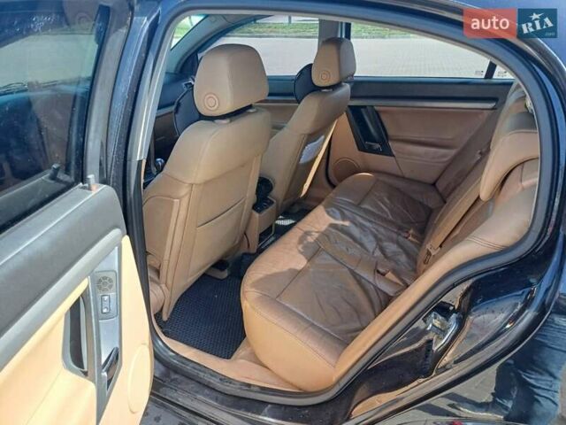 Черный Опель Вектра, объемом двигателя 2.2 л и пробегом 300 тыс. км за 6100 $, фото 5 на Automoto.ua