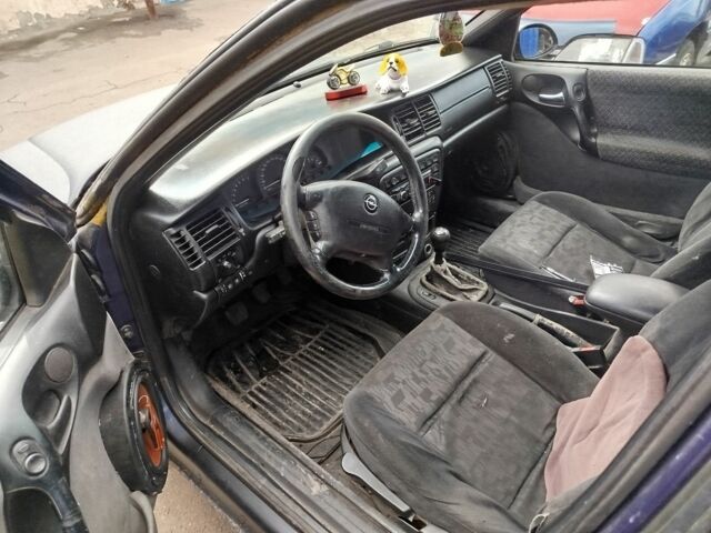 Черный Опель Вектра, объемом двигателя 2 л и пробегом 330 тыс. км за 600 $, фото 6 на Automoto.ua