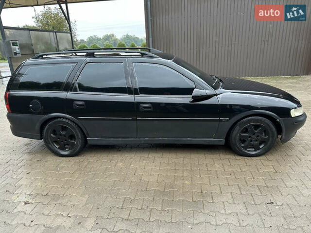 Черный Опель Вектра, объемом двигателя 2 л и пробегом 300 тыс. км за 1000 $, фото 1 на Automoto.ua