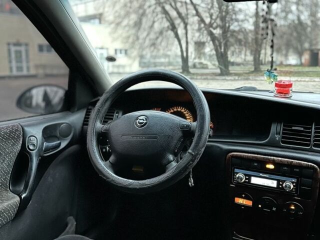 Черный Опель Вектра, объемом двигателя 2 л и пробегом 300 тыс. км за 1800 $, фото 6 на Automoto.ua