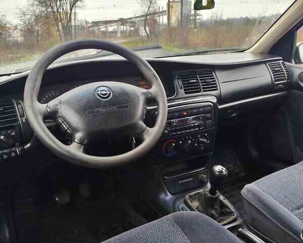 Черный Опель Вектра, объемом двигателя 1.6 л и пробегом 333 тыс. км за 1999 $, фото 10 на Automoto.ua