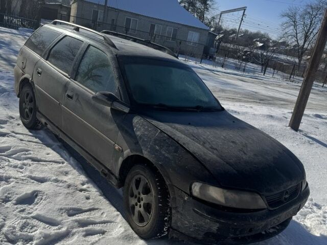 Черный Опель Вектра, объемом двигателя 2 л и пробегом 350 тыс. км за 1550 $, фото 1 на Automoto.ua