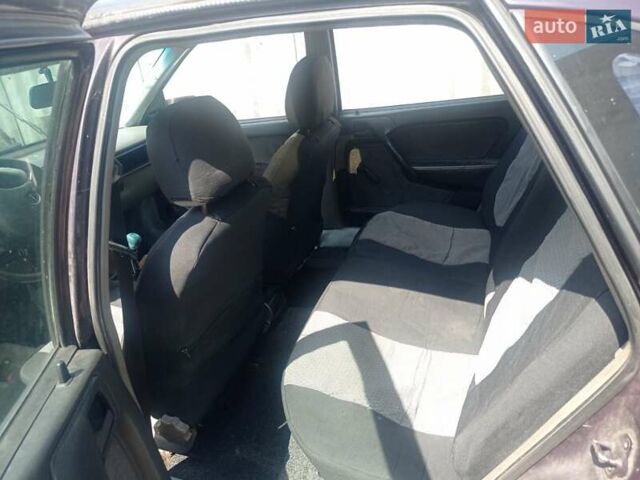 Фиолетовый Опель Вектра, объемом двигателя 2 л и пробегом 244 тыс. км за 1500 $, фото 4 на Automoto.ua