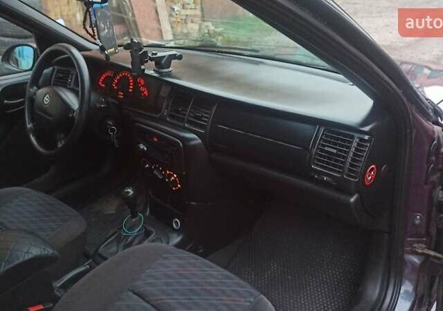 Фиолетовый Опель Вектра, объемом двигателя 1.6 л и пробегом 361 тыс. км за 2150 $, фото 22 на Automoto.ua