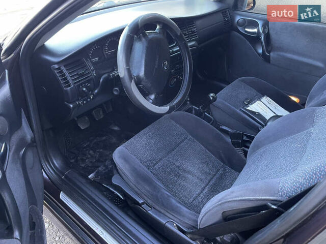 Фиолетовый Опель Вектра, объемом двигателя 1.6 л и пробегом 145 тыс. км за 3750 $, фото 16 на Automoto.ua