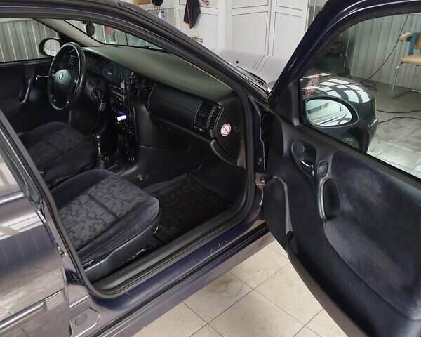 Фиолетовый Опель Вектра, объемом двигателя 2 л и пробегом 226 тыс. км за 2850 $, фото 8 на Automoto.ua