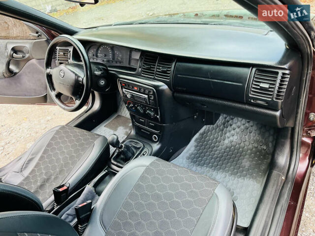 Опель Вектра 1997 в Каменское - Днепродзержинск на Automoto.ua Красный Опель Вектра, объемом двигателя 1.78 л и пробегом 350 тыс. км за 3499 $, фото 24 на Automoto.ua