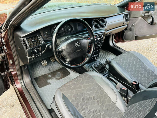 Опель Вектра 1997 в Каменское - Днепродзержинск на Automoto.ua Красный Опель Вектра, объемом двигателя 1.78 л и пробегом 350 тыс. км за 3499 $, фото 21 на Automoto.ua