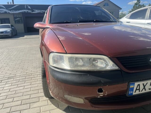 Червоний Опель Вектра, об'ємом двигуна 2 л та пробігом 360 тис. км за 1999 $, фото 5 на Automoto.ua