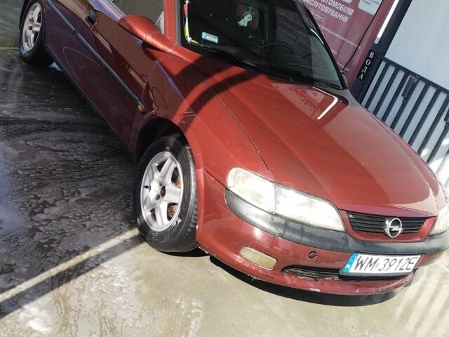 Червоний Опель Вектра, об'ємом двигуна 2 л та пробігом 323 тис. км за 1400 $, фото 1 на Automoto.ua