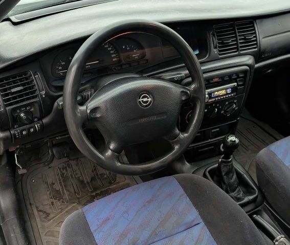 Серый Опель Вектра, объемом двигателя 1.8 л и пробегом 234 тыс. км за 1999 $, фото 9 на Automoto.ua