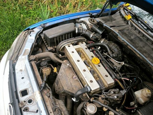 Синий Опель Вектра, объемом двигателя 1.8 л и пробегом 230 тыс. км за 1350 $, фото 4 на Automoto.ua