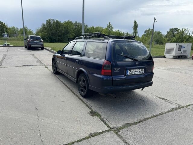 Синий Опель Вектра, объемом двигателя 2 л и пробегом 350 тыс. км за 1350 $, фото 3 на Automoto.ua