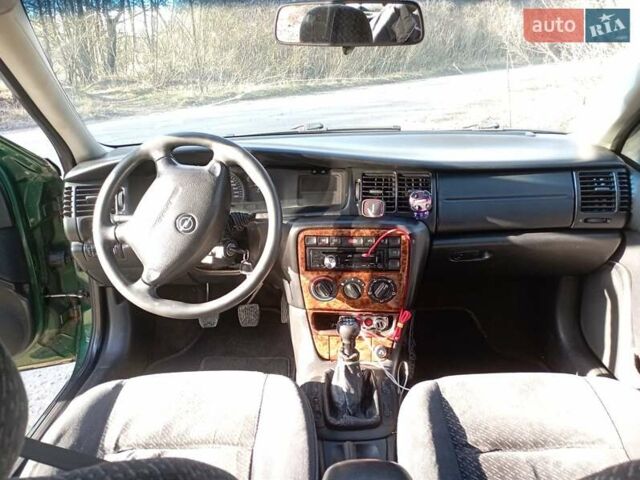 Зеленый Опель Вектра, объемом двигателя 2 л и пробегом 370 тыс. км за 2600 $, фото 6 на Automoto.ua