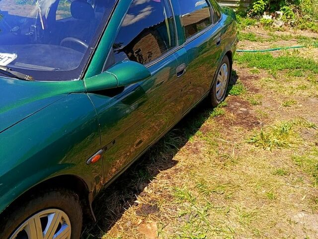 Зеленый Опель Вектра, объемом двигателя 1.8 л и пробегом 380 тыс. км за 2300 $, фото 4 на Automoto.ua