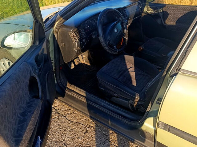 Зеленый Опель Вектра, объемом двигателя 2 л и пробегом 334 тыс. км за 1700 $, фото 5 на Automoto.ua