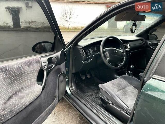 Зеленый Опель Вектра, объемом двигателя 2 л и пробегом 355 тыс. км за 3200 $, фото 11 на Automoto.ua