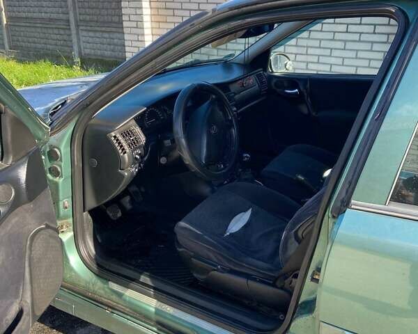 Зеленый Опель Вектра, объемом двигателя 1.6 л и пробегом 404 тыс. км за 2400 $, фото 11 на Automoto.ua