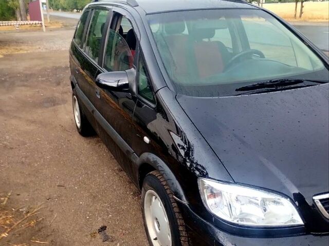 Черный Опель Зафира, объемом двигателя 1.6 л и пробегом 321 тыс. км за 3700 $, фото 2 на Automoto.ua