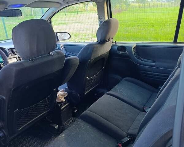 Синий Опель Зафира, объемом двигателя 1.99 л и пробегом 330 тыс. км за 3800 $, фото 4 на Automoto.ua