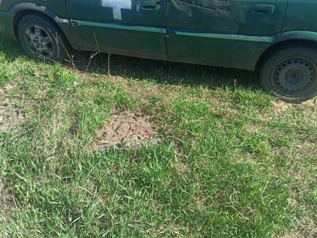 Зеленый Опель Зафира, объемом двигателя 2 л и пробегом 385 тыс. км за 592 $, фото 5 на Automoto.ua